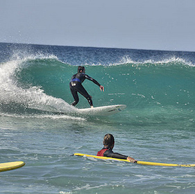 Young boy surfing in Fuerteventura